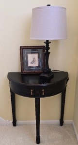 lot 134K image: DR - Black Half Round Console Table, Table Lamp, and Framed Print Set