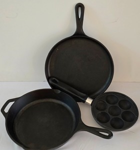 lot 159K image: LR - Set of 3 Cast Iron Pans Lodge 85K 10.5 in, Lodge 90C 10.75 in, and 7 in Egg Pan