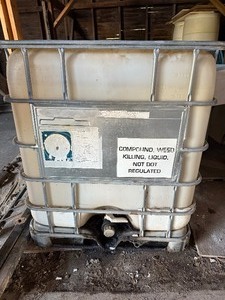 lot 41 image: Used oil container and two barrels