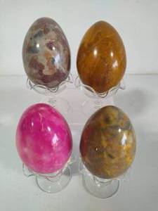 lot 96 image: Set of Four Polished Stone Eggs