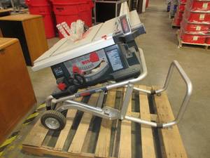 lot 552 image: BOSCH PORTABLE TABLE SAW WITH STAND