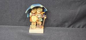 lot 136 image: Hummel Goebel Stormy Weather HUM 71 Figurine West Germany 5.75 Inch