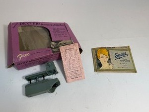 lot 12 image: 1950s Hair Net & Dexter Handheld Automatic Hemmer & Stitcher Sewing Machine