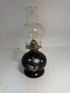 lot 67 image: Black Glass Oil Lamp wClear Chimney wWhite & Gold Floral Decoration