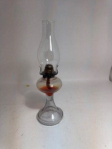 lot 69 image: Vintage Extra Large Clear Glass Oil Lamp with Clear Hurricane Shade  Orange Oil Stained