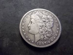 lot 22 image: 1897 O Morgan Silver Dollar