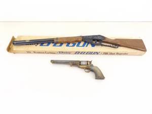 lot 7 image: Black Powder, and Daisy BB Gun Wall Hangers