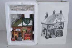 lot 74 image: Department 56 North Pole Series Orlys Bell & Harness Supply - Heritage Village