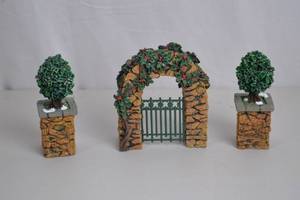 lot 77 image: Dept 56 Village Stone Corner Posts with Holly Tree & Stone Archway