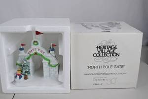 lot 88 image: Heritage Village North Pole Gate Porcelain Christmas Decor