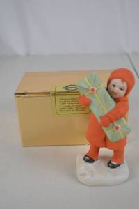 lot 109 image: Jenny Nystrom Handpainted Porcelain Figurine Child with Gift Box
