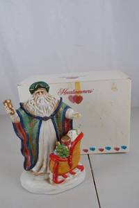 lot 116 image: Heartwarmers Christmas Santa Figurine with Sleigh, 9 Inch with Box