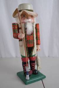 lot 228 image: 15-Inch Fishing Nutcracker with Plaid Coat and Accessories
