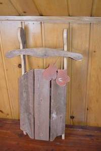 lot 252 image: Rustic Wood Sled Home Decor Accent With Hanging Mittens 33x16 Inches