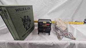 lot 6 image: Willie & Joe WWII Years Volume Set, Leather Pack Strap(like new), Music Box
