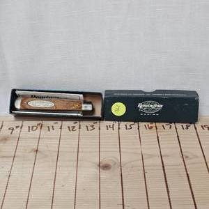 lot 140 image: Remington Racing #75 Knife and Bid Buddy 6 Buck Style Knife
