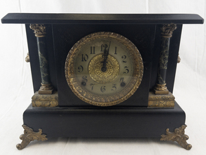 lot 17 image: Antique E. Ingraham Black Mantel Clock with Ornate Brass Details