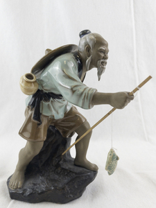 lot 110 image: Vintage Shiwan Chinese Mudman Figurine Fisherman with Hat and Pole