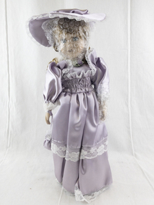 lot 139 image: 16 Inch Porcelain Doll in Lavender Dress with Hat and Curly Hair