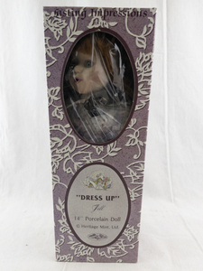 lot 141 image: Heritage Mint Dress Up Jill 14-Inch Porcelain Doll with Outfit, Shoes, and Hat