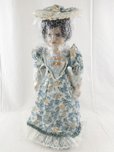 lot 143 image: 16 Inch Porcelain Doll Jenna with Floral Dress and Hat