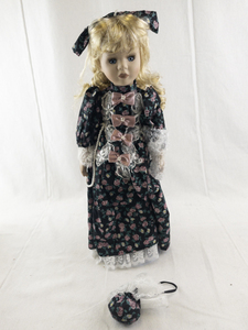 lot 146 image: 16-Inch Porcelain Holly Doll in Floral Dress with Accessories