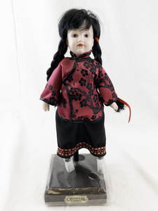 lot 145I image: Collectors Doll China with Stand and Red Floral Outfit