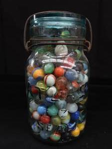 lot 99 image: VINTAGE  ANTIQUE MARBLES  BLUE GLASS ATLAS JAR WITH LID