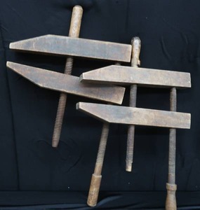 lot 110 image: PAIR OF LARGE WOODEN HAND SCREW CLAMPS.