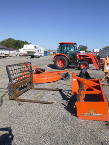 lot 1 image: Kioti KL6010 Tractor with Box  Blade, Rotary Mower, Forks and Loader Bucket