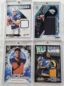 lot 51 image: Leonard Fournette 2017 Panini Donruss Patch Numbered 060199, Darrell Henderson 2019 Panini Absolute War Room Patch Numbered 4249, Andrew Luck 2012 Panini Absolute Star Gazing Patch, Roschon Johnson 2023 Panini Rookie Sweaters Patch