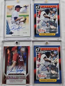 lot 90 image: Danny Santana 2014 Donruss The Rookies Auto, Danny Santana 2014 Donruss The Rookies Auto, Ryan Eades 2013 Leaf Memories Auto Numbered 2650, Aaron Slegers 2013 Panini Elite Extra Edition Auto Numbered 540662