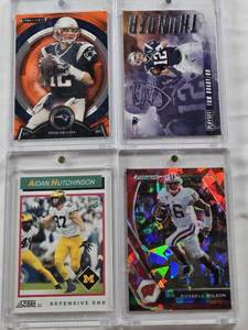 lot 116 image: Tom Brady 2016 Panini Playoff Thunder, Russell Wilson 2021 Panini Prizm, Tom Brady 2013 Topps Stratospheric Stats, Aidan Hutchinson 2022 Panini Score Rookie