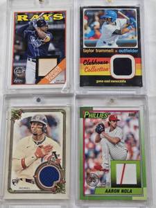lot 125 image: Taylor Trammell 2020 Topps Heritage Clubhouse Collection Patch, Aaron Nola 2025 Topps Patch, Wander Franco 2023 Topps Baseball Relic, Christopher Morel 2023 Allen & Ginter Patch
