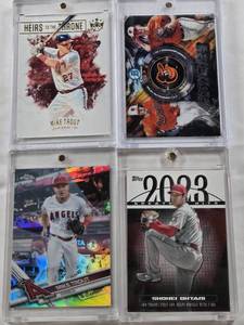 lot 157 image: Shohei Ohtani 2024 Topps Greatest Hits, Adley Rutschman with Gunnar Henderson 2019 Topps Franchise Futures, Mike Trout 2019 Panini Heirs to the Throne with Mickey Mantle on Back, Mike Trout 2017 Topps Chrome Refractor
