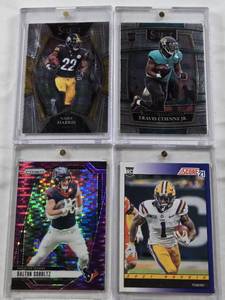 lot 215 image: Travis Etienne Jr. 2021 Panini Select Rookie, Ja Marr Chase 2021 Panini Score Rookie, Najee Harris 2021 Panini Select Rookie, Dalton Schultz 2024 Panini Prizm Refractor