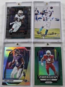 lot 221 image: Tua Tagovailoa 2020 Panini Rookie, Trey Benson 2024 Panini Prizm Emergent Rookie, Jaylen Waddle 2021 Panini Select Rookie, Lamar Jackson 2024 Panini Prizm Refractor