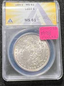 lot 32 image: 1898 US MORGAN SILVER DOLLAR ANACS ERROR SLAB MS61