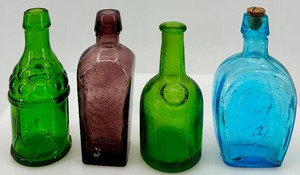 lot 22 image: Set of 4 Colored Glass Bitters Bottles