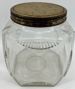 lot 30 image: Vintage Clear Glass Jar with Metal Lid and Embossed Design