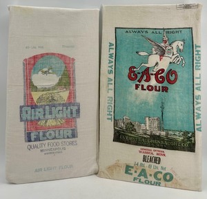lot 101 image: Pair of Vintage Flour Sack Cloth Bags EACO and Air Light 49 lb Advertising