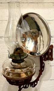 lot 339 image: Antique Wall-Mounted Kerosene Oil Lamp with Reflector and Ornate Cast Iron Bracket