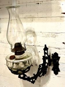 lot 340 image: Antique Wall-Mounted Glass Oil Lamp with Cast Iron Bracket