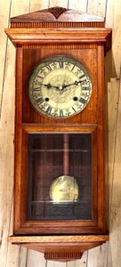 lot 353 image: Antique Wood Case Wall Clock with Brass Pendulum and Roman Numeral Dial