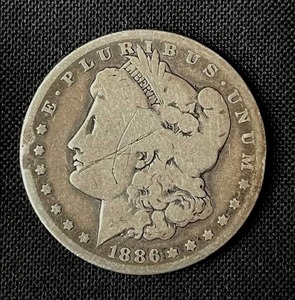 lot 16 image: 1886-O Morgan Silver Dollar