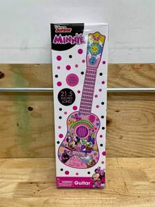 lot 223 image: Disney Minnie Mouse Kids Guitar   Minnie Mouse Pink Guitar Music Set with Real Tuning Pegs and Strings for Learning Music   Fun Band Musical Instruments for Kids Age 3 and Up   21.5 Inch