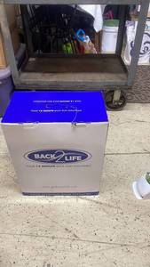 lot 34 image: Back2Life 12 Minute Back Pain Solution in Original Box