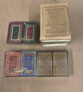 lot 54 image: 14 Decks of Dayco Gold Label Diesel Playing Cards and Golle Luxury Playing Cards