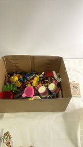 lot 199 image: Box of Assorted Toy Cars, Play Dishes, and Mini Figures