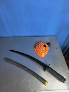 lot 69 image: Plastic Sword and Cyclopes Pumpkin Head Mask